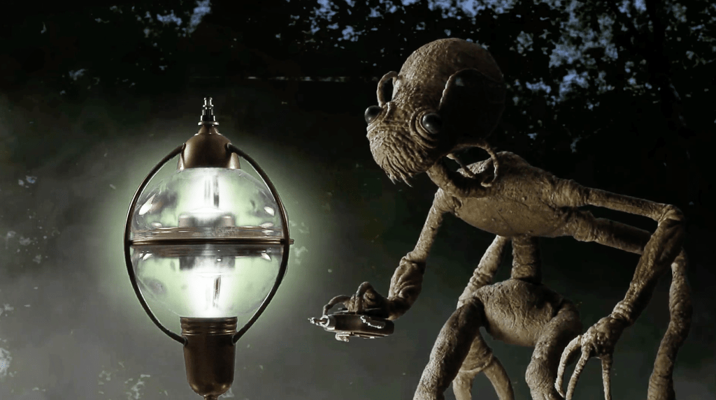 A shot of the extraterrestrial pilot during the pre-credits sequence
