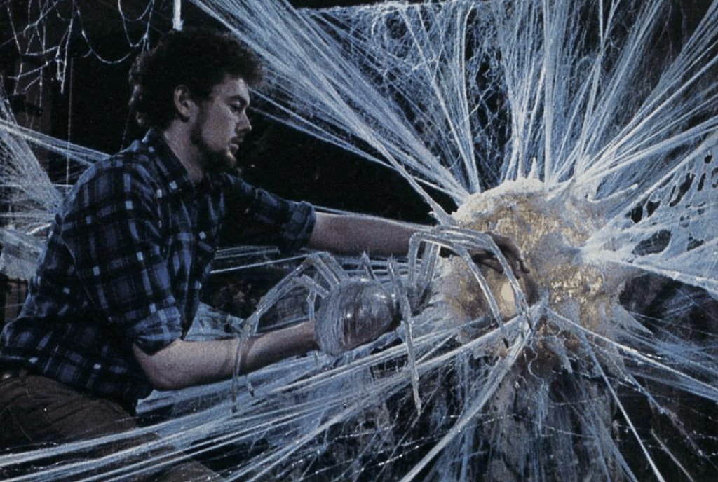 A behind the scenes shot od Steve with the spider puppet